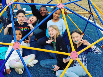 Diverse group of children in a jungle gym